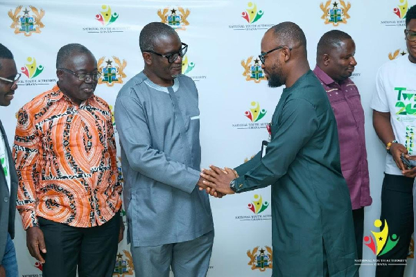 Osman Ayariga of the NYA (R) in a handshake with Prof Kwabena Biritwum of the KNUST