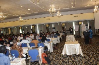 A keynote speaker delivering a speech to stakeholders present at the conference