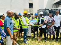 Prof Alfred Edwin Yawson and staff receiving the architectural drawings from Abass Adams Nurudeen