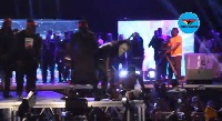 Shatta Wale slapped his bodyguard for preventing a fan from holding his [Shatta Wale] leg