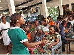 File photo: A nurse speaking to patients at the Korle-Bu Teaching Hospital