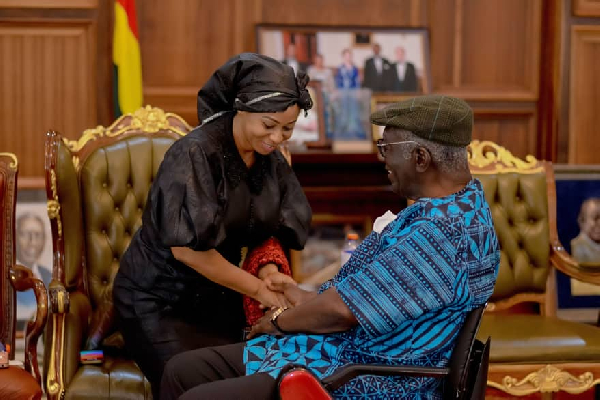 A photograph of Sarah Adwoa Safo (L) and Former President John Agyekum Kufuor (R)
