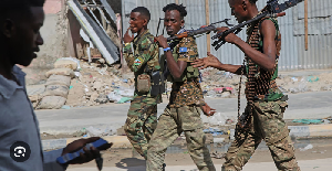 Somali soldiers patrol a street after a clsh between statye secuirity and opposition supporters