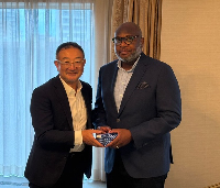 COCOBOD CEO, Randy Abbey (R) and a member of the Japanese partners (L)