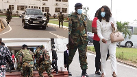 Shots of EC boss Jean Mensa and the soliders protecting her