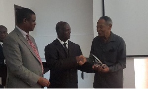 Professor Francis K. Nkrumah receiving his award from Dr. Ebenezer Appiah Denkyirah of the GHS