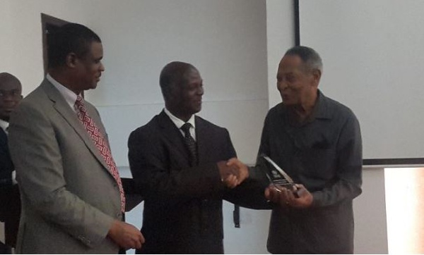 Professor Francis K. Nkrumah receiving his award from Dr. Ebenezer Appiah Denkyirah of the GHS