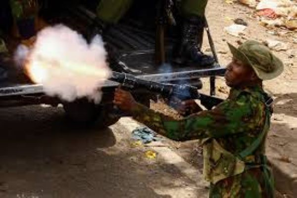 Kenya police officers block a main road leading to the central business district in Nairobi on July