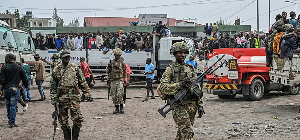 M23 rebels escort government soldiers and police who surrendered