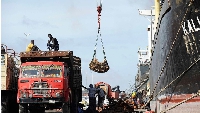 Porters offload goods in the sea port of Mogadishu, Somalia