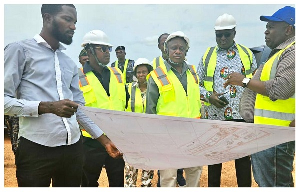 Ashanti Regional Minister Simon Osei Mensah being taken through the site plan