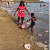 Emelia Brobbey with daughter at Barry Island beach