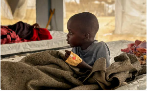 A child infected with cholera receives treatment in the cholera isolation centre in a refugee camp