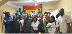 Ambassador Namoale in African print, pose for a photo with Ghanaians in Sao Paulo