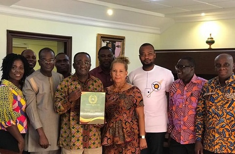 Dr. Owusu Afriyie Akoto displaying his award