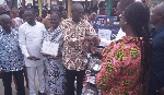 Josephine Nkoom presenting an award to the overall best farmer in Ayensuano district