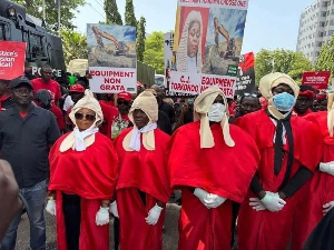 Protestors wore make-shift costumes of Supreme Court justices astatine  the demo