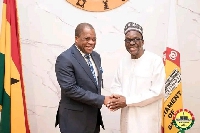 Rev. Wengam in a hand shake with the Speaker of Parliament, Alban Bagbin