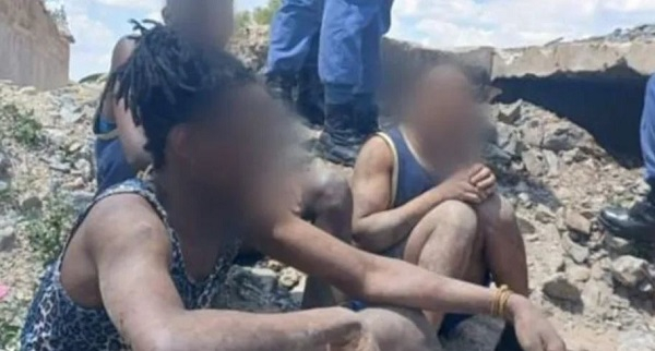 Illegal miners forced out of an abandoned mine shaft and arrested