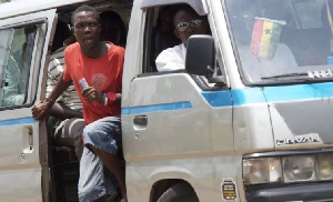 Trotro mate shouting for passengers