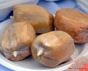 Kenkey is made from corn and covered with its leaves to give it a great fragrance