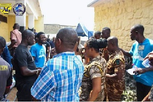 Prophet Arjarquah interacting with some prison officers after donating items to the prisoners