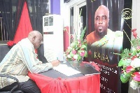 Late Alhaji Iddrisu Bature signing the book of condolence at KABA's memorial