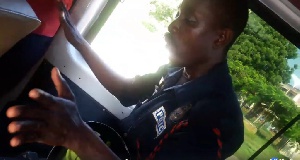 The drunk  Police officer was seen misconducting himself in the trotro while on duty