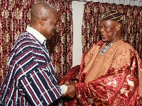 Buipewura Abdulai Jinapor II congratulating the Vice President after decorating him with a smock