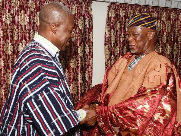 Buipewura Abdulai Jinapor II congratulating the Vice President after decorating him with a smock