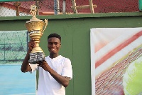 Reginald Okantey with the trophy