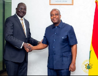 South Sudan diplomat shakes hands with Thomas Ampem Nyarko, Deputy Minister for Finance (Right)
