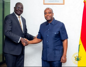 South Sudan diplomat shakes hands with Thomas Ampem Nyarko, Deputy Minister for Finance (Right)