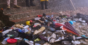 The shoes of victims of a deadly stampede sit by the main entrance of the Citadelle Laferriere