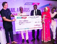 Hamidu Mohammed, Dealer of the Year (2nd from left) with the COO of Puma Energy West Africa (left)