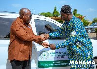 John Dramani Mahama presenting the keys to the vehicle to Abdul Karim Bapuni, head of the unit