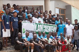 A section of Olam staff and management, with Country Head second from left