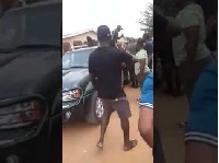 The angry Nigerians blocked the road and prevented the officers from leaving the scene
