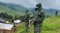 EACRF soldiers on guard in Mushaki, North Kivu province in the DR Congo