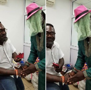 Countryman Songo receiving a handshake from 'Anas'