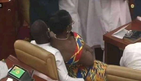 An old photo of Ursula Owusu-Ekuful sitting on Mintah Akandoh in parliament