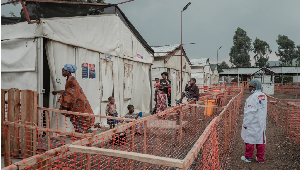 Patients stand at an mpox treatment centre at Nyiragongo General Referral Hospital, in DRC