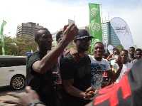 Dancers mob Peter Okoye as he stepped out of his Limousine at the national Theatre