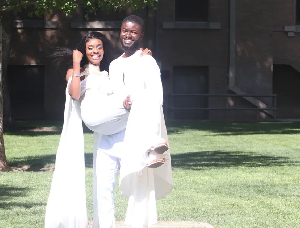 Dadzie, Ghana's 200m record holder, is captured with his sweetheart, both dressed in white