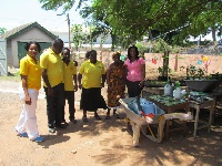 Juliette Mills-Lutterodt (Far right) in a pose with Principal  and some students