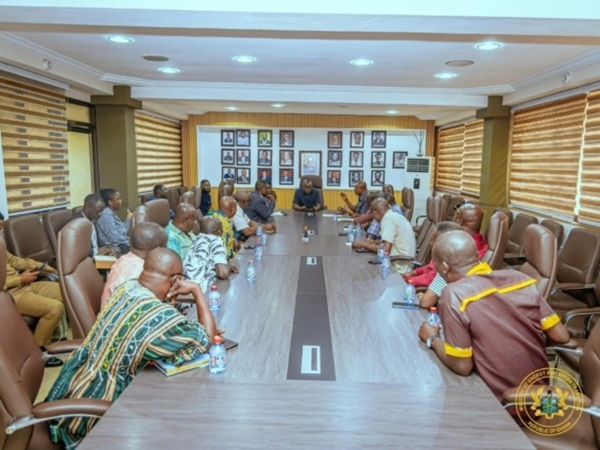 Energy minster engaging with the tanker drivers in his office
