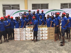 Players of AshantiGold  SC posing with the drinks presented by