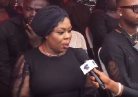 Afia speaking to a reporter at the funeral grounds of the late Ebony