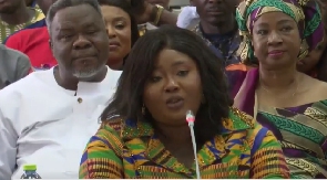 Dr. Kwaku Oteng seated behind his daughter, Francisca Oteng, during vetting in parliament
