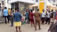 Ghanaians queue at offices of network operators to register complaints about blocked of SIM cards